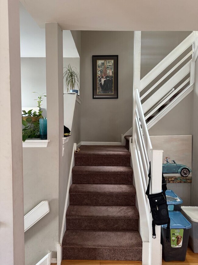 Building Photo - Stunning 3–4 Bedroom Townhome in Private Community | Garage + EV Charger | Deck with Tree Views