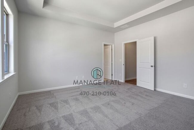 Building Photo - Modern 3-level Townhome featuring 4 bedroo...