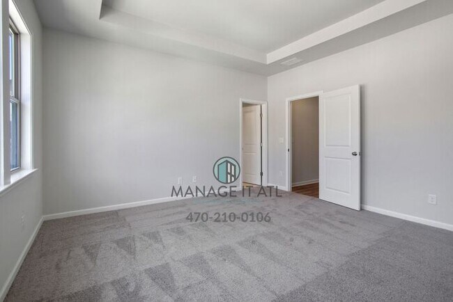 Building Photo - Modern 3-level Townhome featuring 4 bedrooms and 3 1/2 baths