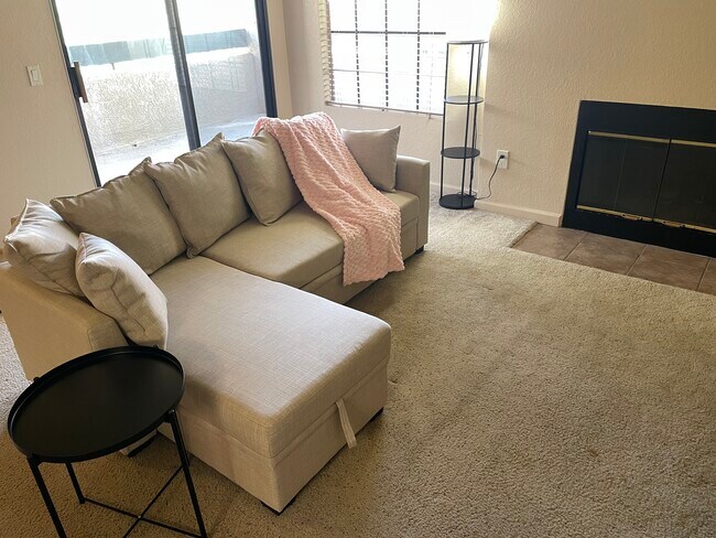 Living room and sliding door to the patio - 101 S Players Club Dr