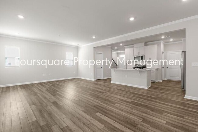 Building Photo - Coming Soon; July 27, 2026 : End unit ToSpacious End-Unit Townhome with 2nd Floor Loft, Screened-...