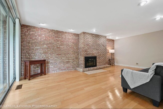 Brick wall with hardwood floors - 5600 Hillcrest Ln