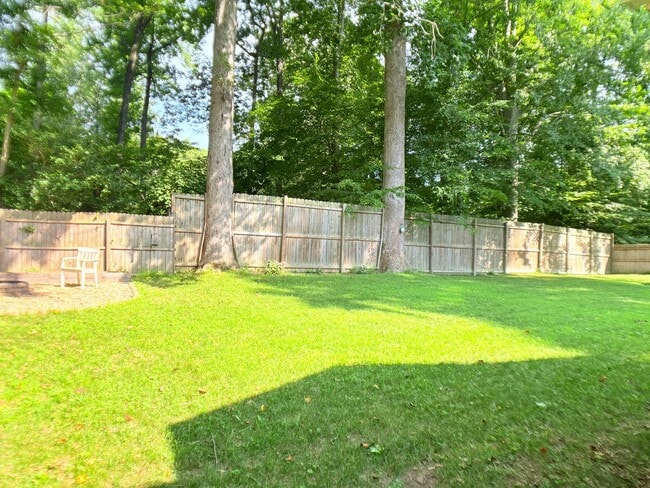Building Photo - Large fenced in yard and Sun room!