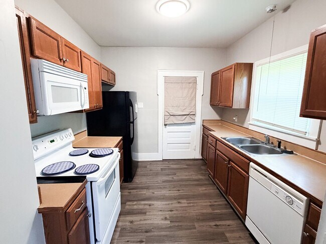 Building Photo - COMING SOON! 2b 1.5 ba w basement, Lawn Care + Trash Included