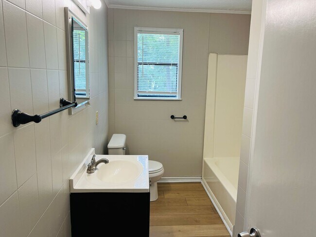 Building Photo - Wow! Check out this charming 4-bedroom, 1-...
