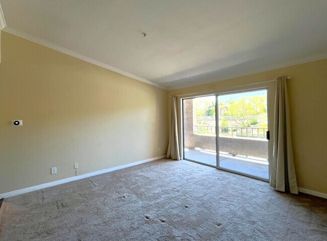 Building Photo - 1BR Condo with Private Balcony, Central A/C & Community Amenities in Corona