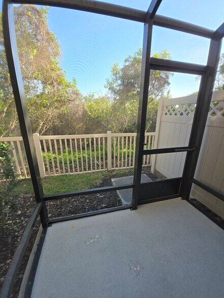Screened in lanai overlooking conservation. - 30149 Southwell Ln