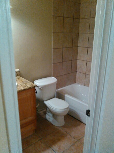 Master Bath- Updated shower tile and flooring - 7933 Bles Ave