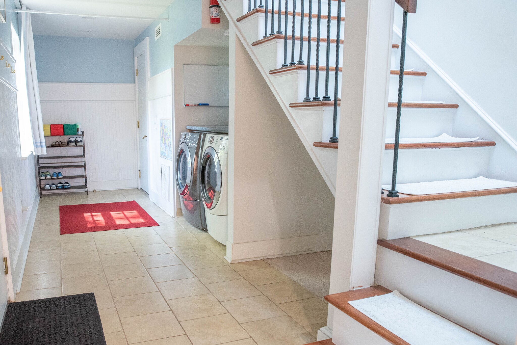 The secondary staircase in the laundry room leads to an area that is off-limits to tenants. - 417 E Government Ave