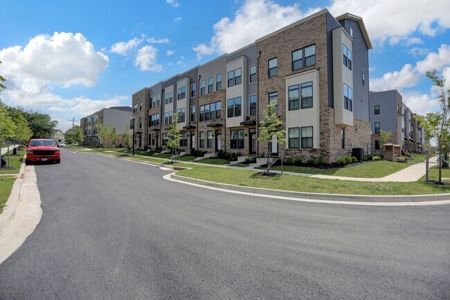 Building Photo - Luxury 4-Story Townhome with Rooftop Terrace!