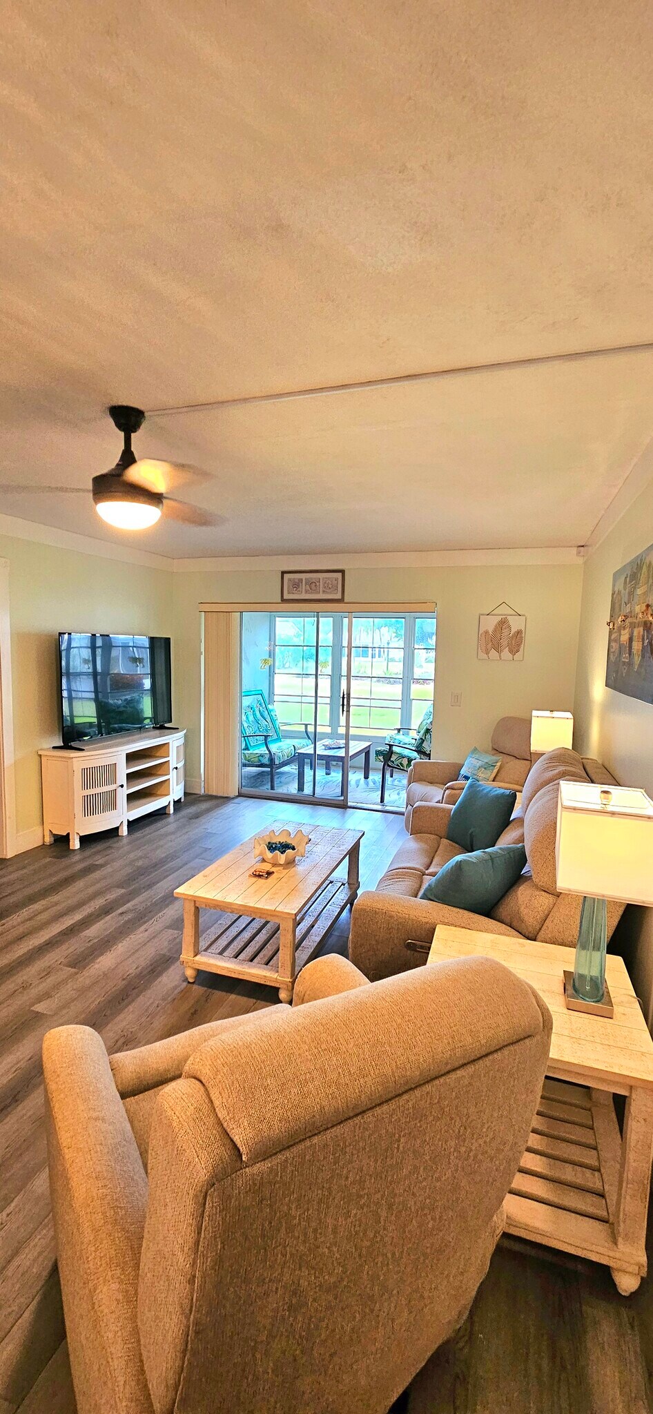 Living room with sliders to ground floor & green area - 8740 Lueck Ln