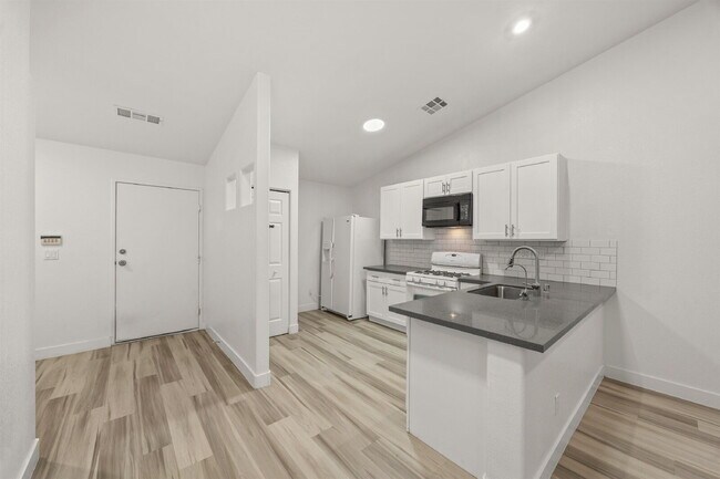 Building Photo - Charming and spacious single-story townhome nestled within a gated community in the desirable Nor...