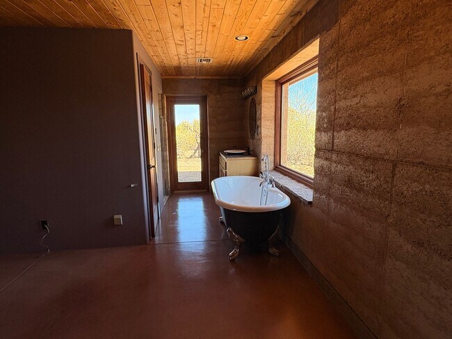 Building Photo - Desert Home on 3.3 Acres with Rooftop Views & Unique Rammed Earth Design