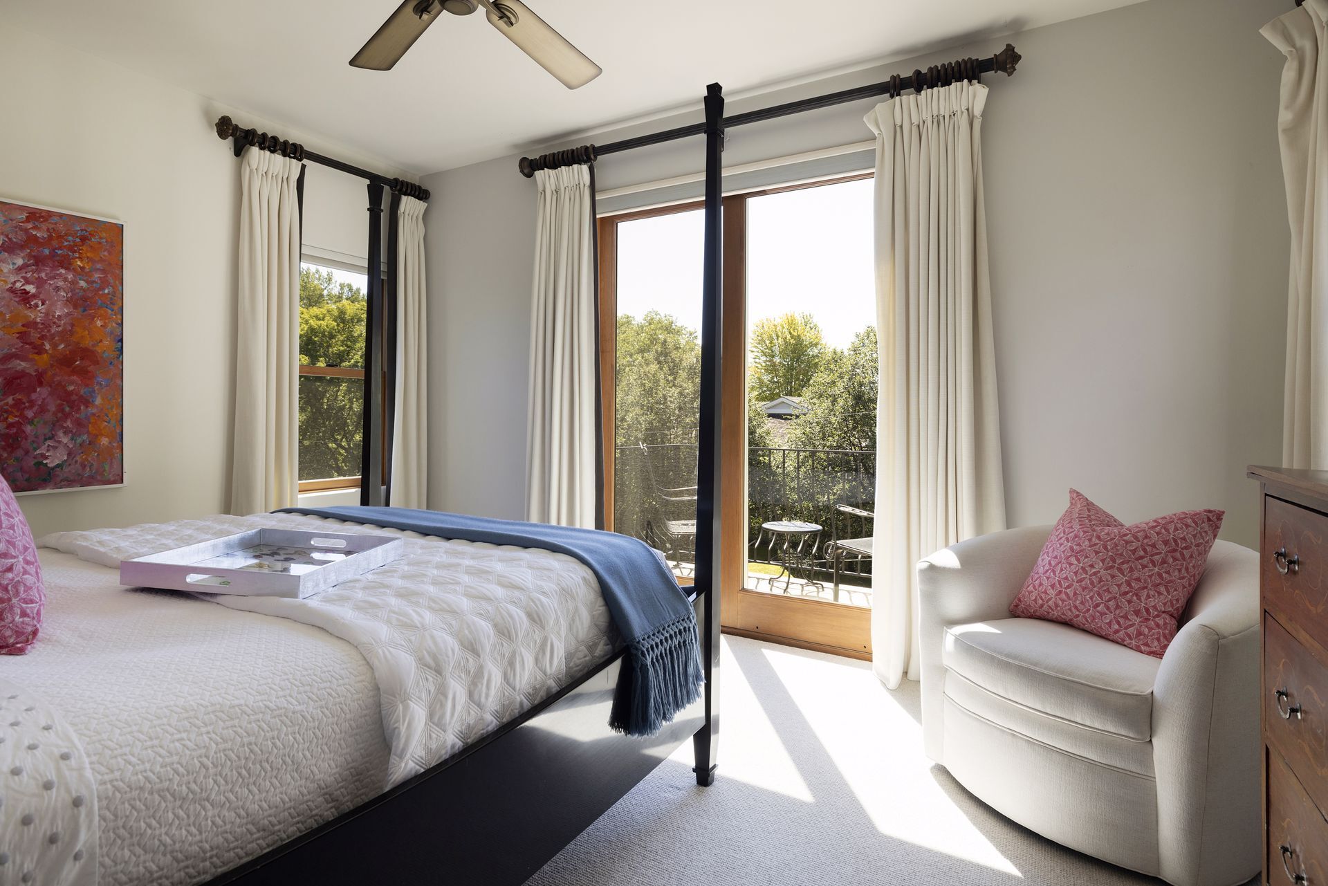 Step into the primary bedroom with access to the south-facing private balcony - 745 Rice St E