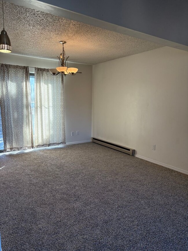 Building Photo - 1 Bedroom 1 Bath Townhome with Garage Parking in Village Seven