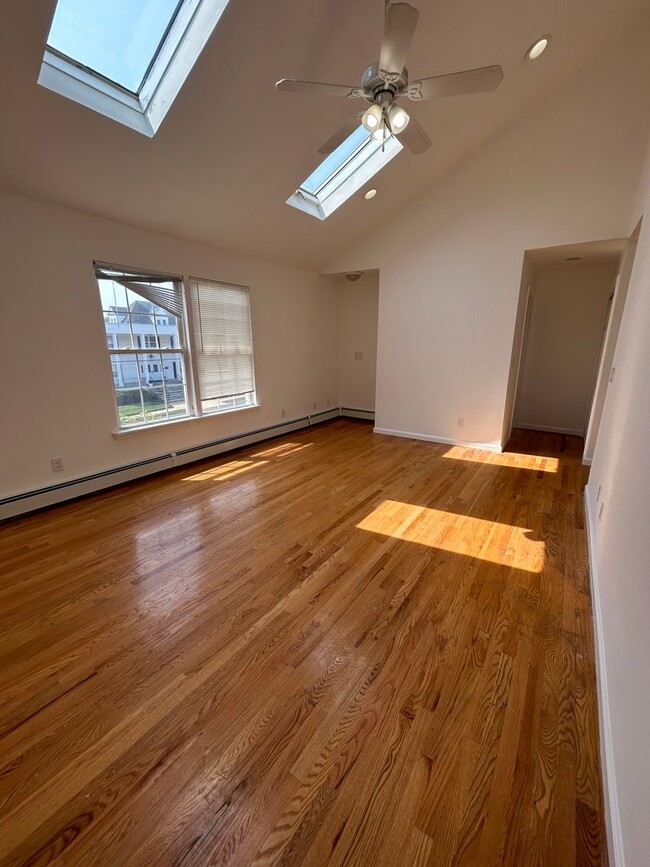 Building Photo - Discover Your Dream Home in Neptune: Spacious 4-Bedroom, 2.5-Bath with Private Backyard and Drive...
