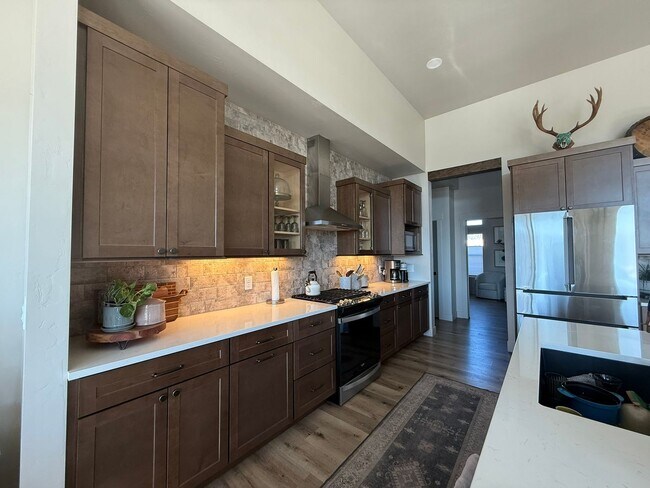 Building Photo - Your Private Oasis Awaits: Spacious 4BR Home with Premium Amenities