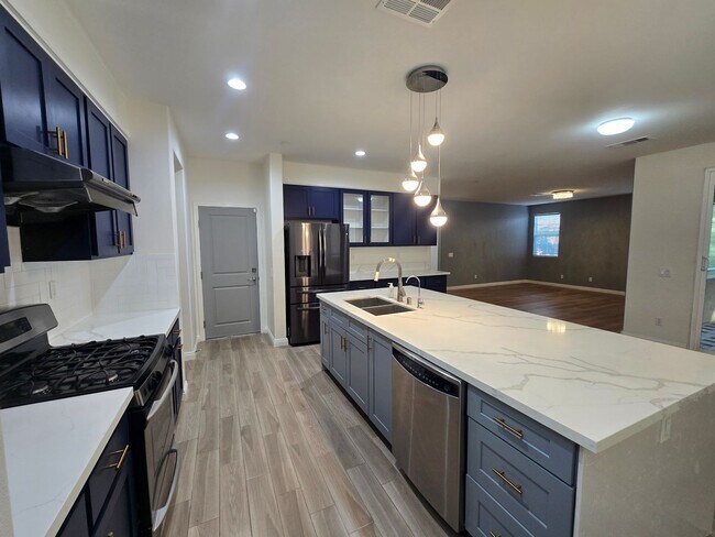 Building Photo - Open-Concept Living with Downstairs Bedroom & Enclosed Patio Retreat