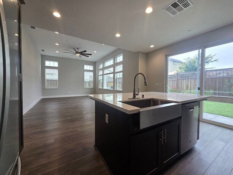 Great room and back yard from kitchen - 1429 Brody Bird Ln