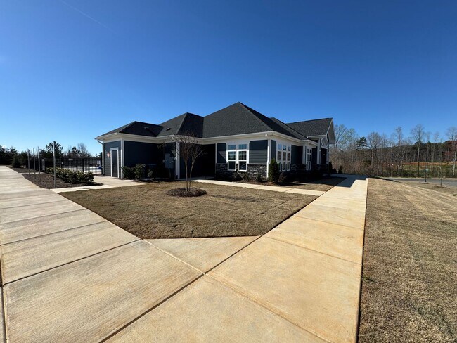 Building Photo - Spacious 1.5-Story 4BR Home with Bonus Room in Active 55+ Community