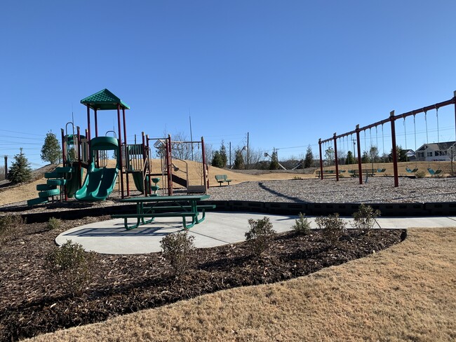 Playground and cook out area with picnic tables at Villages at Hunters Point - 9010 Fenton Rd.