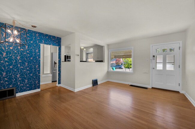 View into kitchen and to front of house. - 114 N Foote Ave