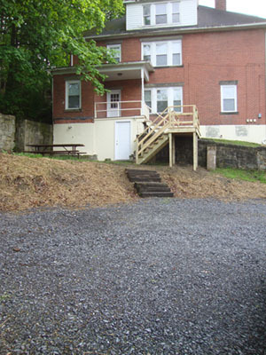 Large parking area with steps up to back porch entry into kitchen. - 14 E Weber Ave