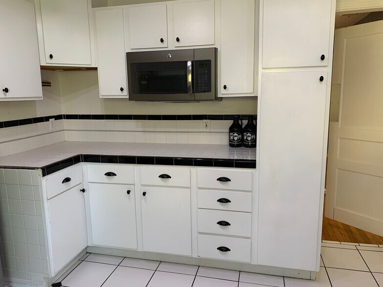 Pull out pantry shelving, updated microwave and dishwasher - 309 Irvington Dr