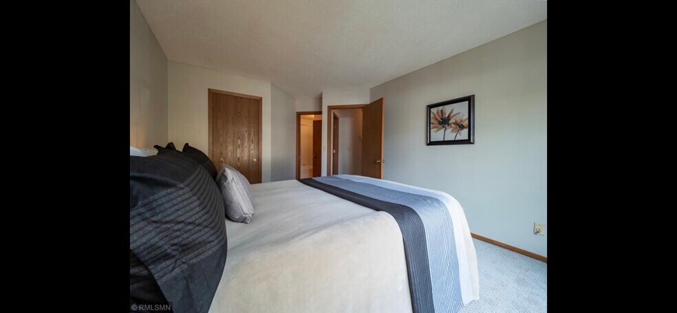 Primary bedroom, walk in closet, attached to bathroom - 10918 Quebec Ave S