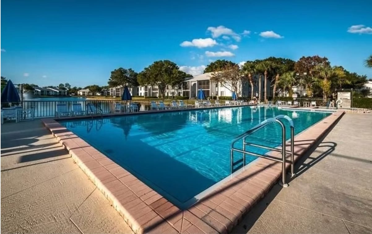 Large heated pool and large hot tub at clubhouse - 1353 Pine Ridge Cir E