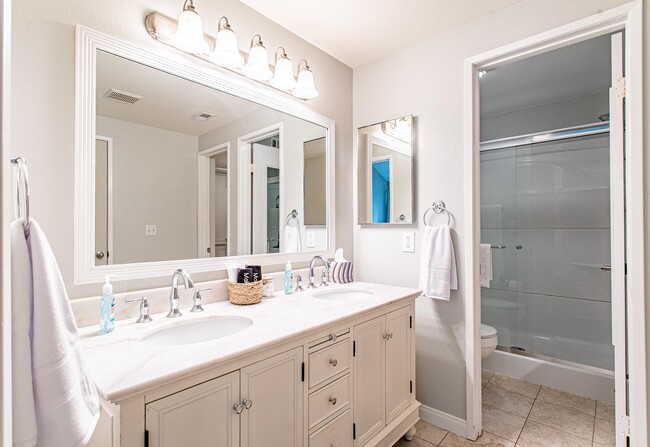 Inset double vanity sink and mirror gives you plenty of room to get ready for the day - 24137 Del Monte Dr