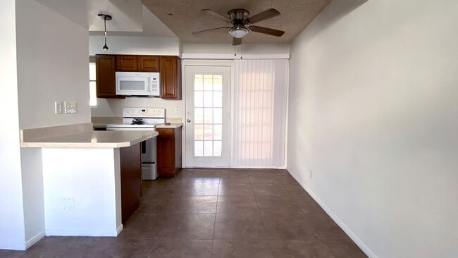 Building Photo - Great 3 bedroom and 1.5 bath townhouse with a small yard and 2 car garage.