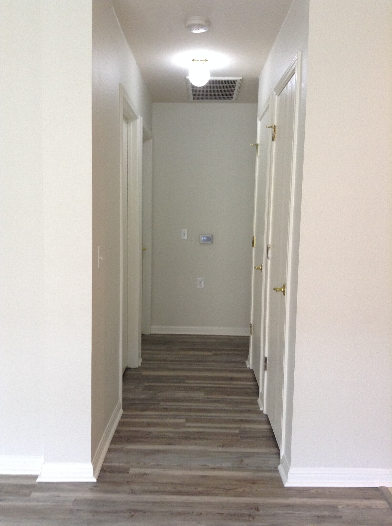 Hallway to secondary bathroom and second/third rooms - 5605 Bentsen Ln
