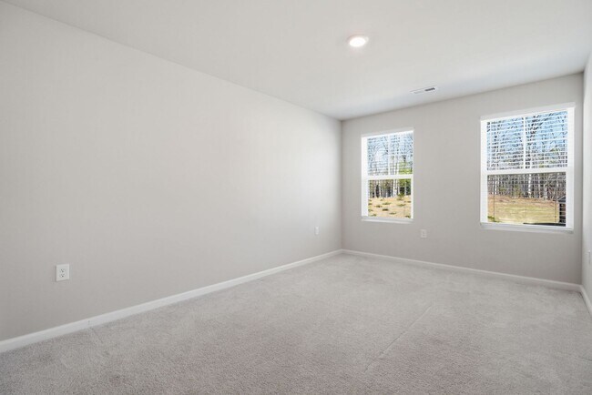 Building Photo - Upgraded 3BR Townhome in Wake Forest | Open Layout, Garage & Resort-Style Amenities