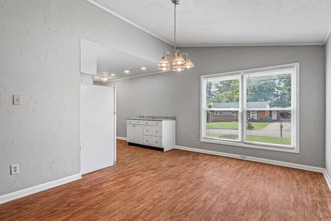Building Photo - NE – Desirable Neighborhood, Brick Home, Wood/Laminate Flooring, Vaulted Ceilings, Carport, Fenced!