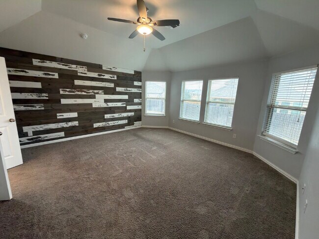 Building Photo - Four bed two bath on a corner lot with a pool in Sunfield. Gas cook top, double ovens. Open kitch...