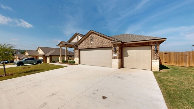 Building Photo - Discover this spacious 4-bedroom, 2-bath home with 3 CAR GARAGE!!!