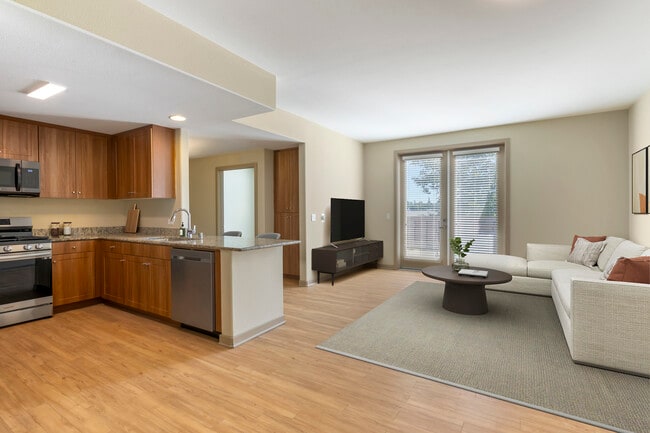 Renovated Package I kitchen and living room with hard surface flooring - Avalon San Dimas