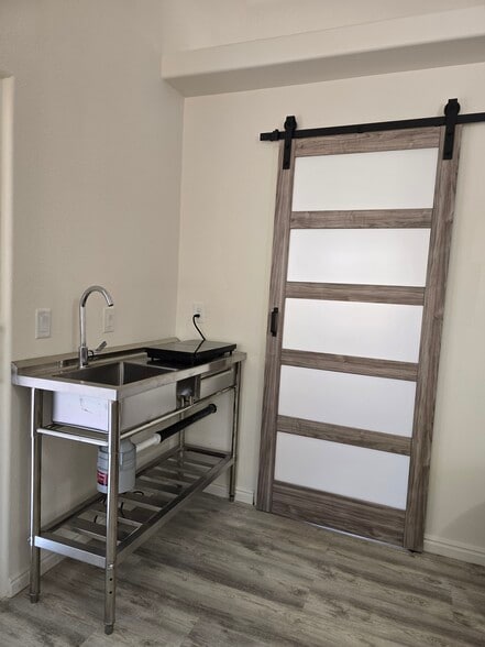 19. Brand-new kitchenette in SE corner of living room (with swivel faucet) next to barn door - 137 E 755 S