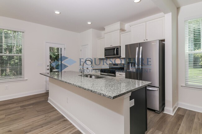 Building Photo - Charming End Unit Townhome With Back Patio...