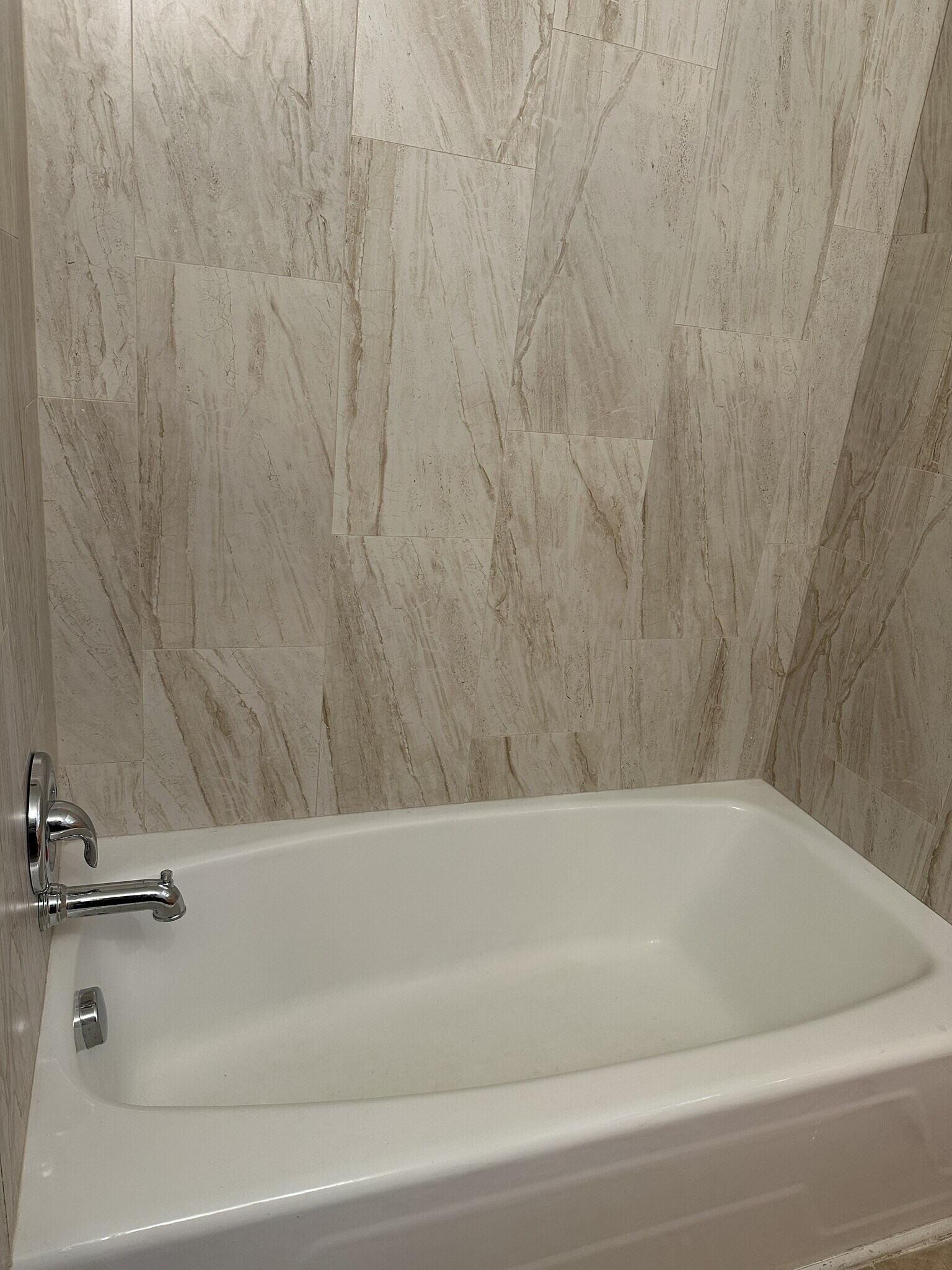 newly renovated bath tub in primary bathroom - 2317 Francine Rd