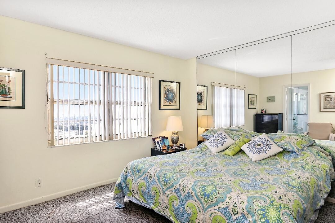 Master bedroom with ocean view from window. - 1500 S Ocean Blvd