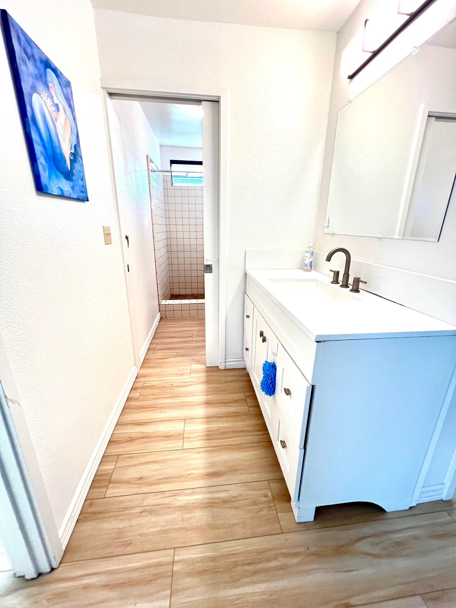 Convenient bathroom design with a separate vanity area and walk-in shower. - 74-5054 Kealapua St