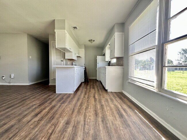 Building Photo - Updated Home with Gorgeous Floors & Large Backyard