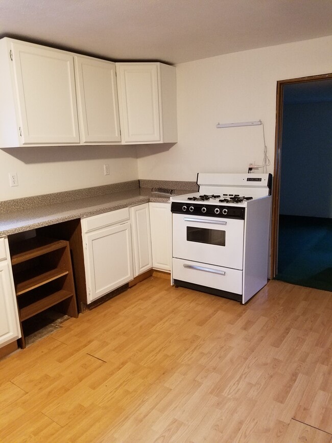 Kitchen, west wall with gas range. - 15 Goodrich St