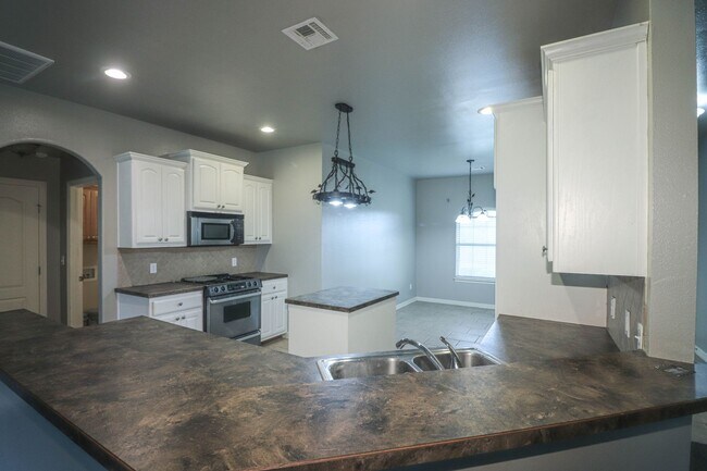 Building Photo - New vinyl plank in bedrooms, hall, new paint, new heat & air conditioning system 2025, large livi...