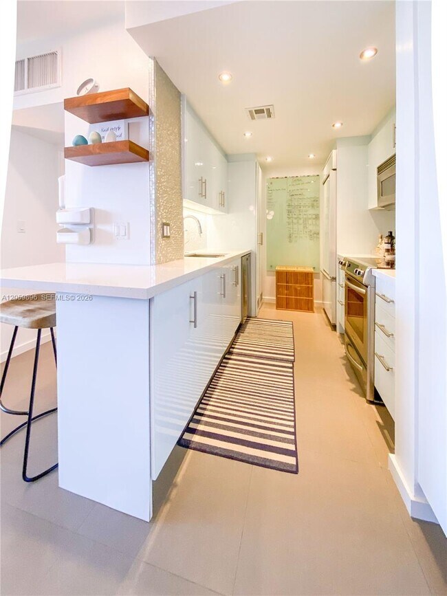 Building Photo - 10275 Collins Ave