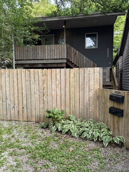 Partially privacy fenced. House to the right has been demolished and yard is now open. - 105 W Florida Ave