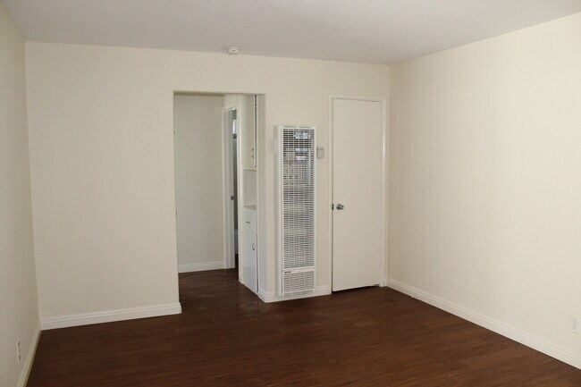 Living Room with new heater and coat closet - 4435 E Ocean Blvd