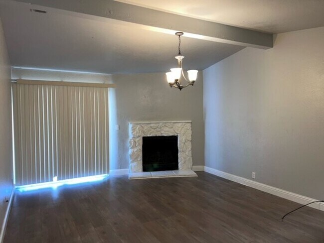 Building Photo - Laminate flooring throughout. Solar panels...